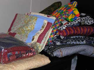 picture of large stack of quilts